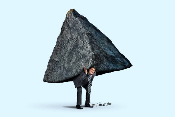 istock Man Trying To Move Mountains 1296022375