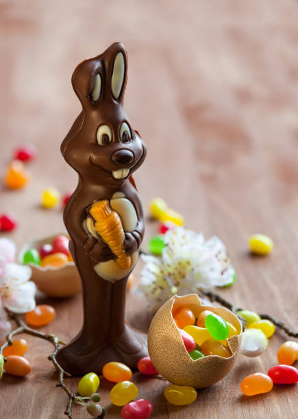 istock Chocolate Easter Bunny with sweet candy on the wooden table 1296023769