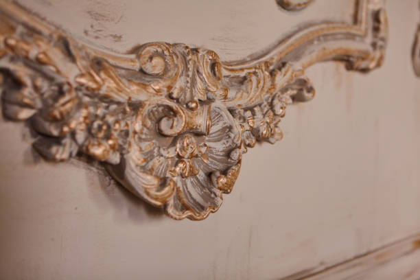 istock Beautiful white stucco patterned on the boundary wall. Vintage white wall bas-relief stucco in plaster. 1296027037
