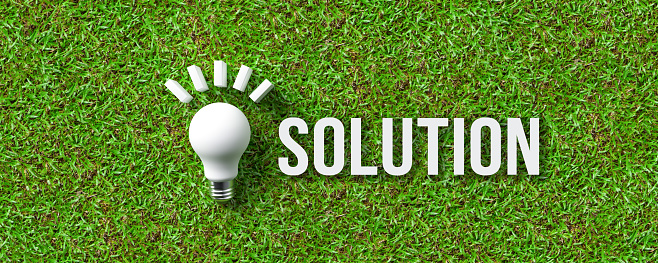 message SOLUTION and a lightbulb symbol on grass background - 3d illustration