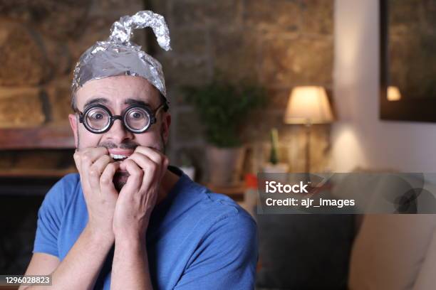 Distrustful Man Wearing Weird Tinfoil Hat Stock Photo - Download Image Now - QAnon, Alien, Cult