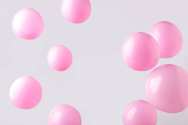 istock Pink pastel baloons on grey background. Minimalism 1296029486