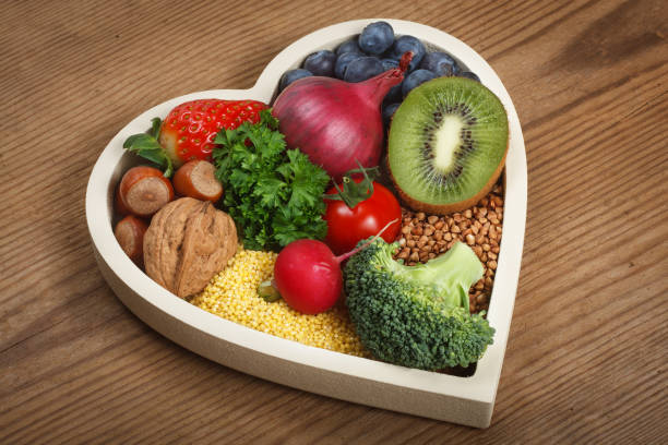 healthy food in heart shaped bowl - diabetes superfoods imagens e fotografias de stock