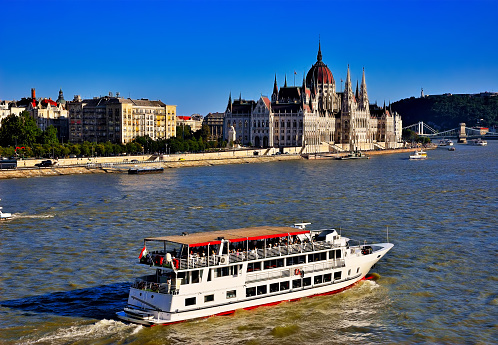 Kamp-Bornhofen, Germany, Europe, July 22, 2023 River cruise ship traveling in front of a beautiful medieval German village.