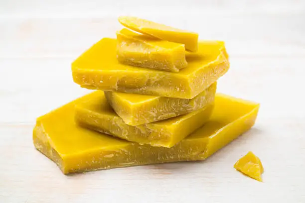 The pieces of natural pure organic yellow beeswax for natural beauty and DIY project.