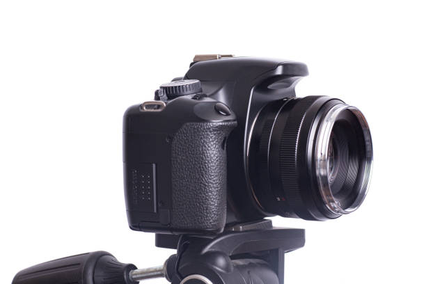 istock Digital photo camera on black tripod isolated on white background 1296032283