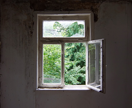 open window in an old abandoned house, lost place