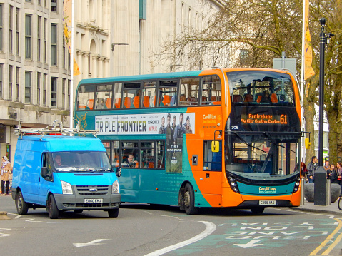 Cardiff, Wales - March 2019: Double decker bus operated by Cardiff Bus driving in a bus lane in Cardiff city centre.