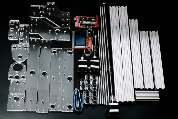 istock a set of parts for a laser machine on a black background, silver backlight, flat lay open-source hardware and software board for controlling the machine and v slot aluminum profile lies 1296035542