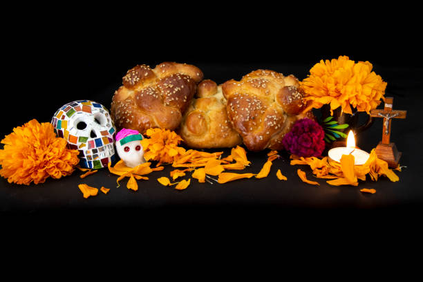 istock Trdaitional bread (Pan de Muerto) with cempasuchil flowers and skulls 1296036343
