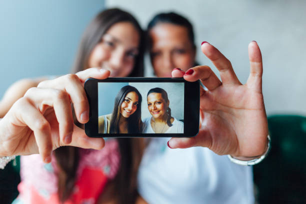 istock Two Women Making Self Portrait In A Cafe 1296036438