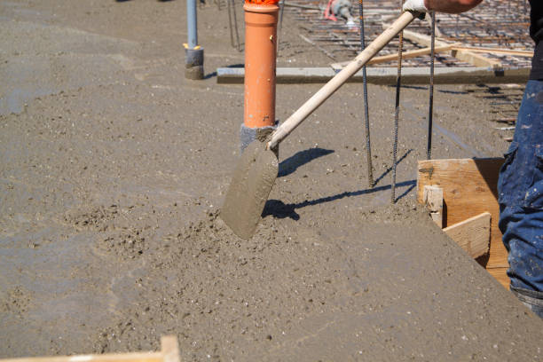 istock working shifts the cement shovel, to make a smooth leveling conc 1296036549