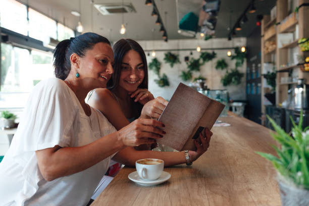 Mother And Daughter In A Cafe