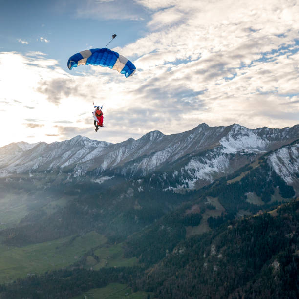 istock Paraglider flies through clear skies in the morning 1296037049