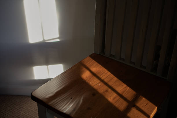 istock Sunlight hitting wooden chair 1296038033