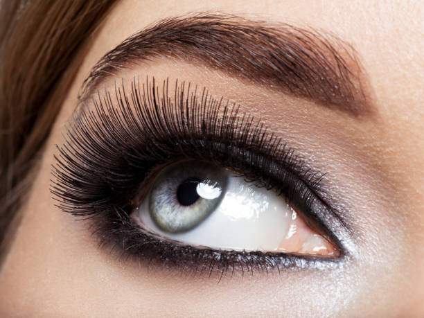 istock woman's eye with black eye makeup. Macro style image 1296039529