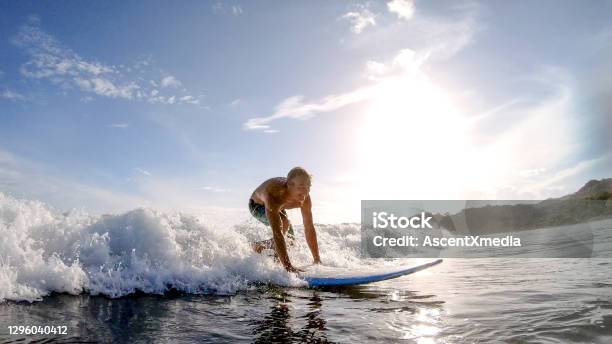 Pov View Of Man Learning To Surf In The Morning Stock Photo - Download Image Now - Surfing, Breaking Wave, Senior Adult