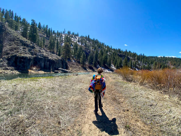 istock Beautiful day hike along the river 1296044114