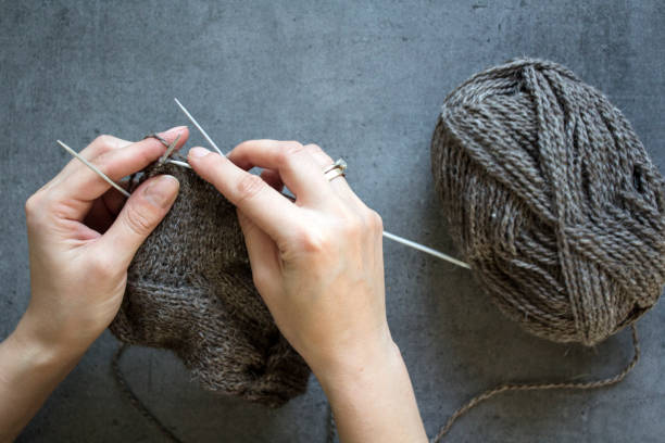 istock Woman knits socks 1296047197