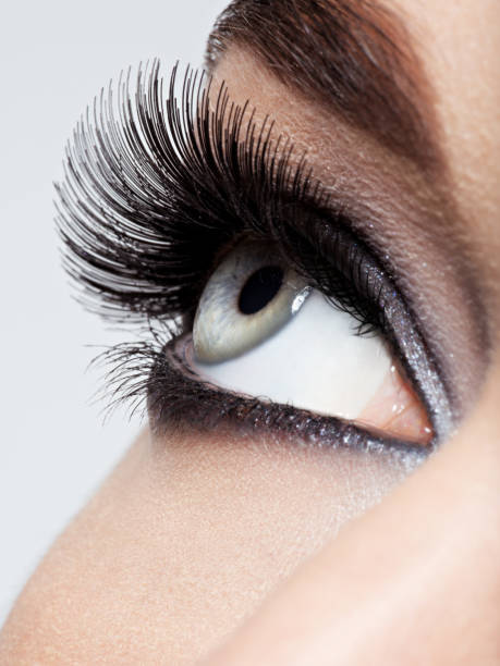 istock woman's eye with black eye makeup. Macro style image 1296047466