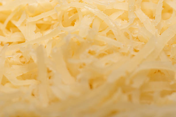 Soft focus. A bunch of grated hard cheese. Food background.