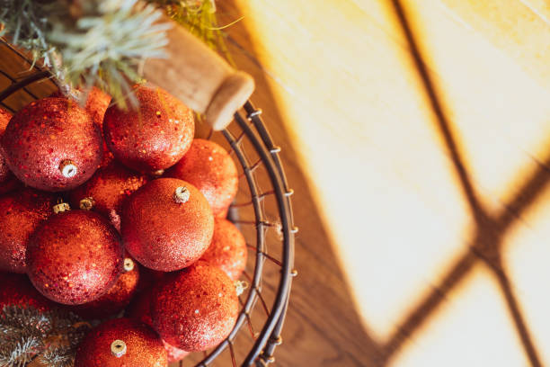 istock Red Christmas Ornaments in a Wire Basket 1296049665