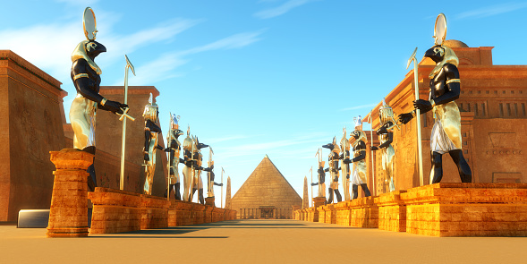 Statues of Egyptian gods line a street in ancient Egypt including Amun, Anubis, Hathor, Horus, Maat, and Ra.