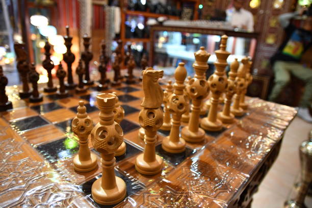 istock Wooden art chess board and figures 1296052567