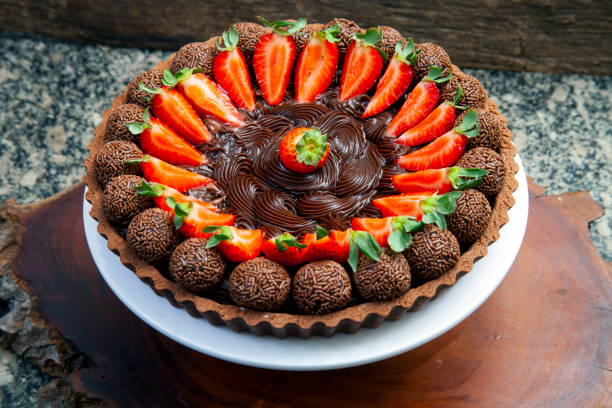istock chocolate pie with strawberries and Brigadeiro sweets 1296056595