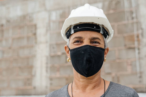 istock Senior engineer woman wearing protective mask 1296059080