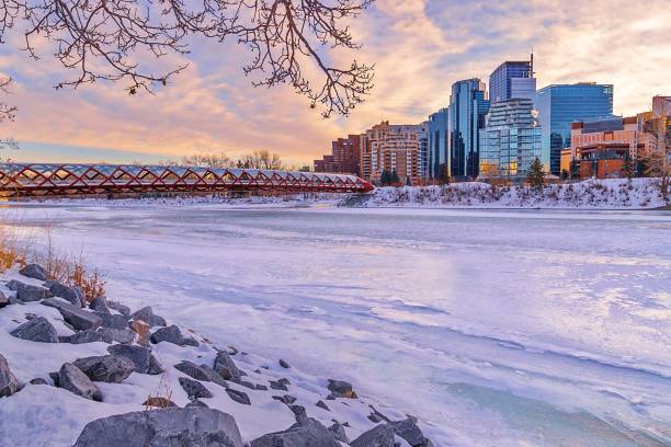 istock Sunrise Clouds Over A Frozen Bow River 1296059195