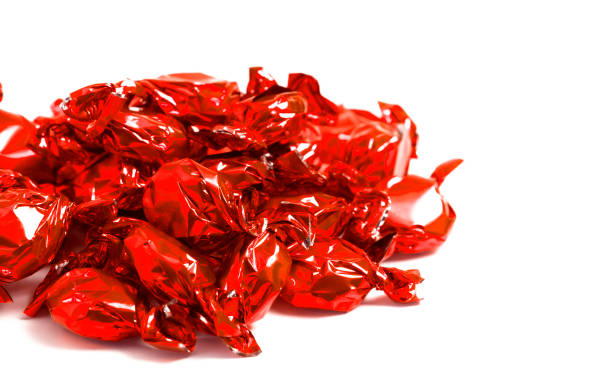 istock A Pile of Red Wrapped Candy Isolated on a White Background 1296061355