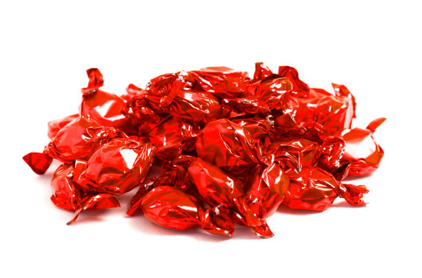 istock A Pile of Red Wrapped Candy Isolated on a White Background 1296061451