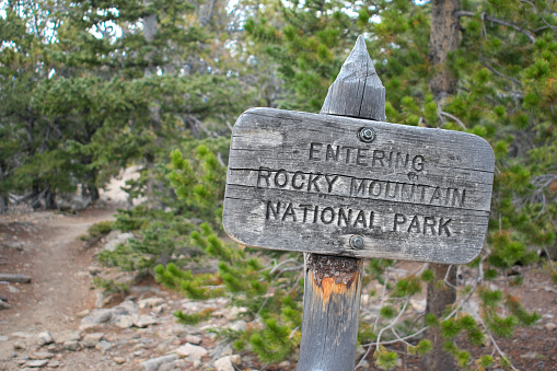 Entering Rocky Mountain National Park - Sign and Hiking trail
