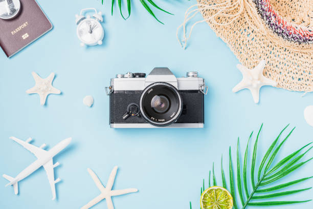 istock camera films, airplane, passport, starfish, shells traveler tropical accessories 1296067256