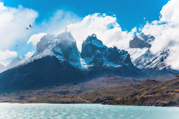 istock The cliffs of Los Cuernos by the lake 1296067478