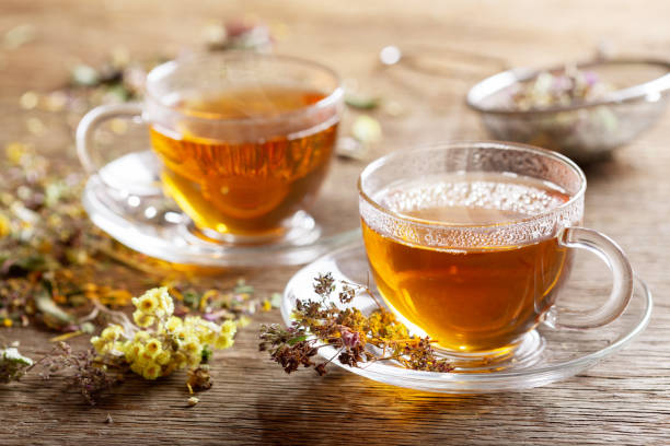 istock Cups of herbal tea with dried herbs 1296067509