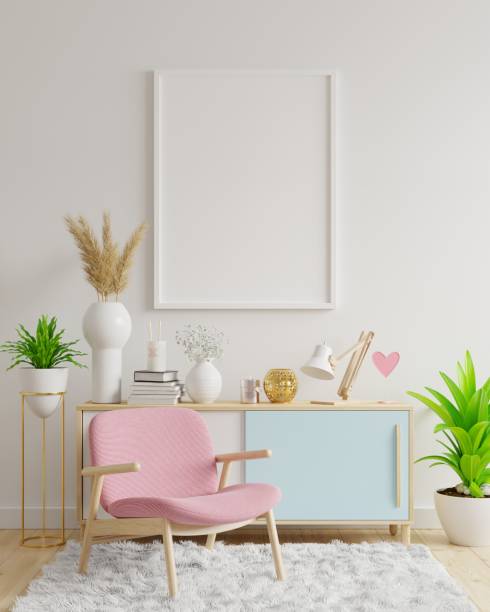 istock Poster mockup with vertical frames on empty white wall in living room interior with pink velvet armchair. 1296071291