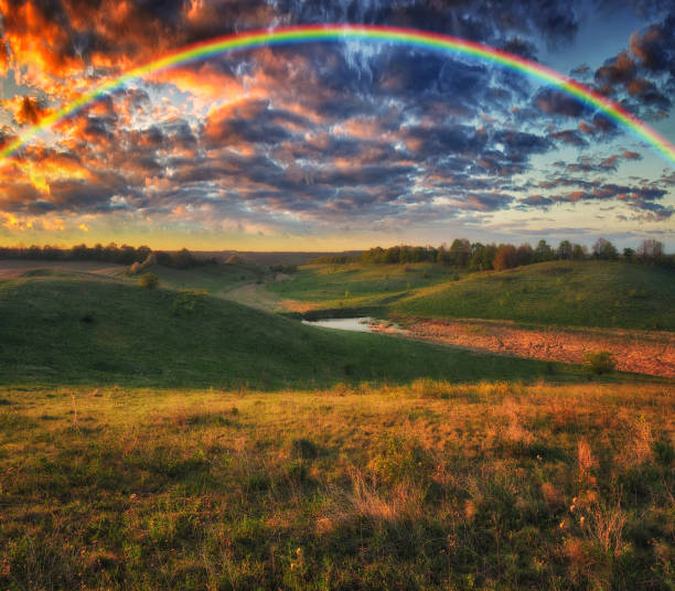 istock Landscape with a Rainbow on the River in Spring 1296073709