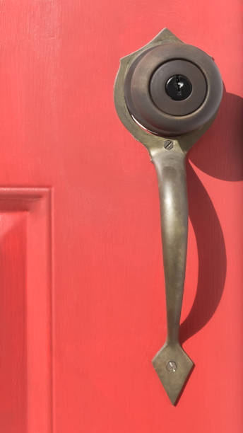 istock Old Door Handle on red Door 1296074542