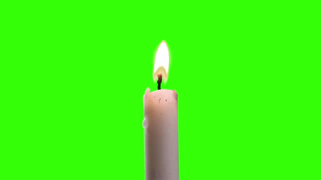 Candle on Green Screen Background. Close-Up.