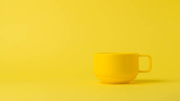 istock Yellow stylish bowl on a yellow background. 1296074560