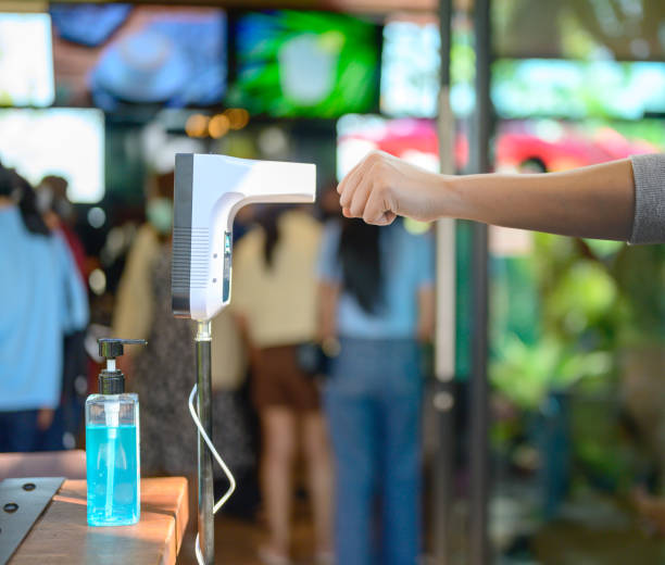 istock Body temperature check Before entering the restaurant to protect against Corona virus and stop the spread of COVID-19. New normal lifestyle. 1296076926