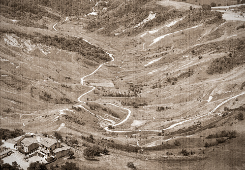 landscape with houses, view from a hill in San - Marino.  Old style. Sepia