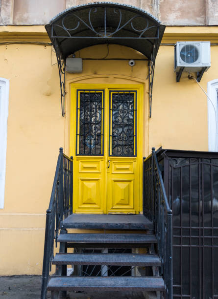 istock Illuminating yellow color door. 1296079178