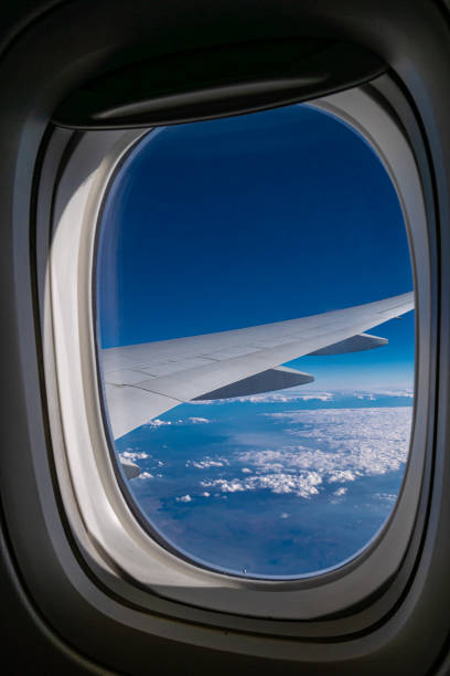 istock The airplane wing view from aeroplane window with beautiful atmosphere blue sky 1296080811