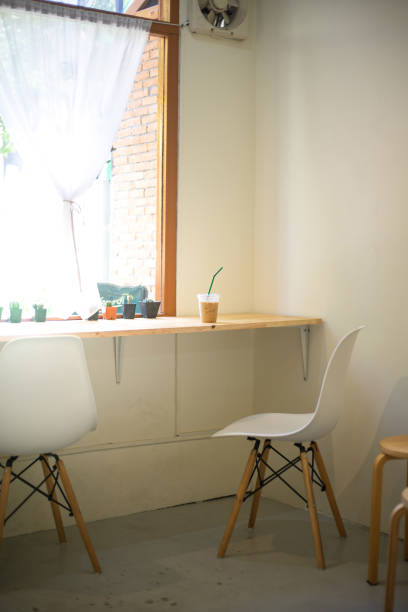 istock Ice coffee on table in coffee shop, white color style 1296082044