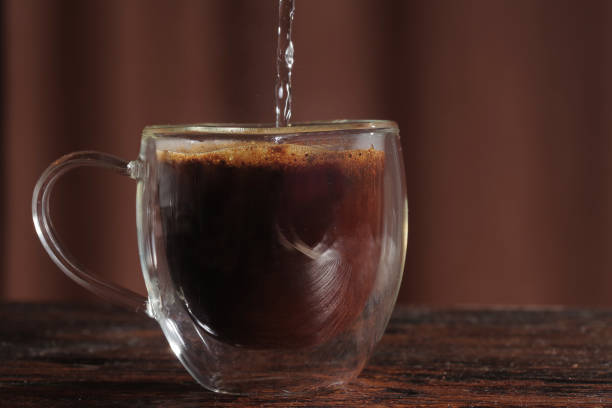 istock Hot black coffee on the old wooden table 1296082159