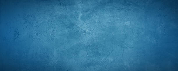 istock dark and blue concreate and cement wall to present product and background 1296082866