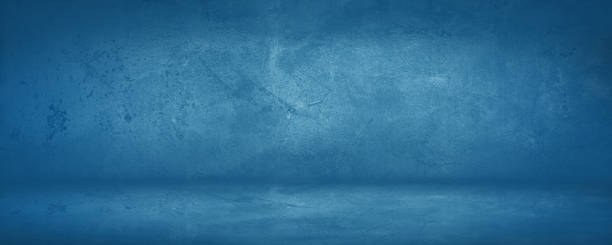 istock dark and blue concreate and cement wall and studio to present product and background 1296082870